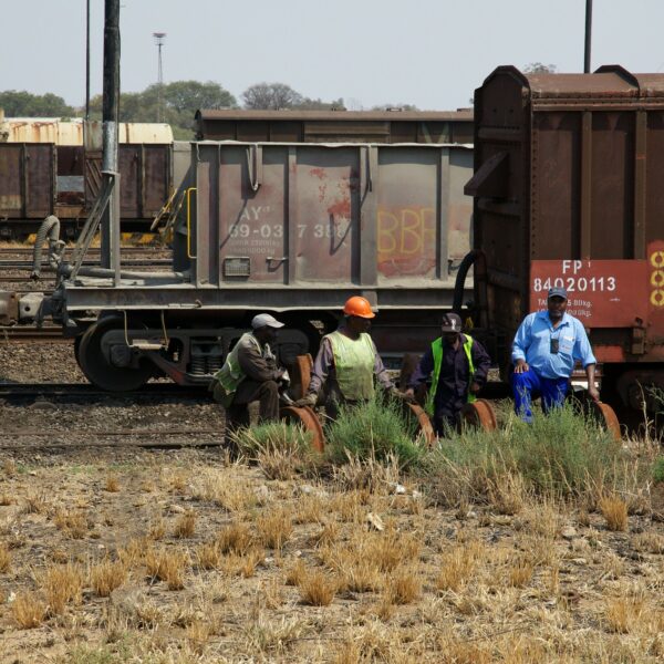 Industrial workers near a railroad in Zimbabwe